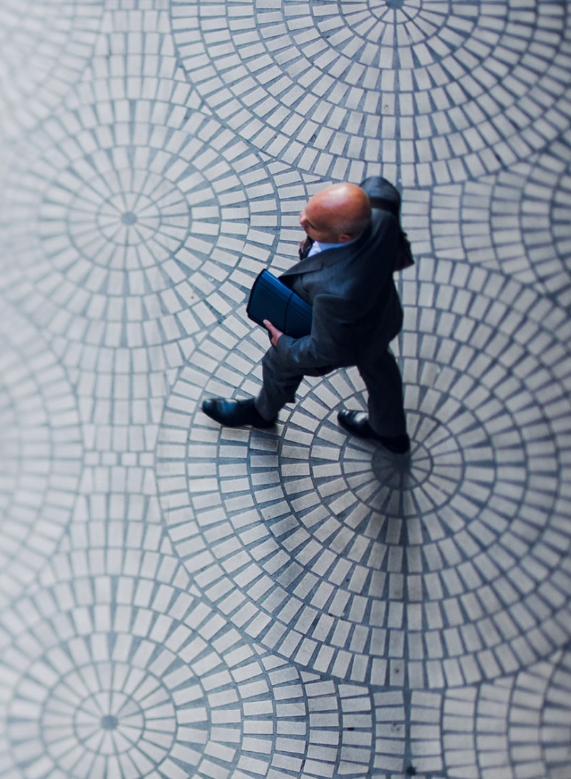 Man walking on a mosaic floor